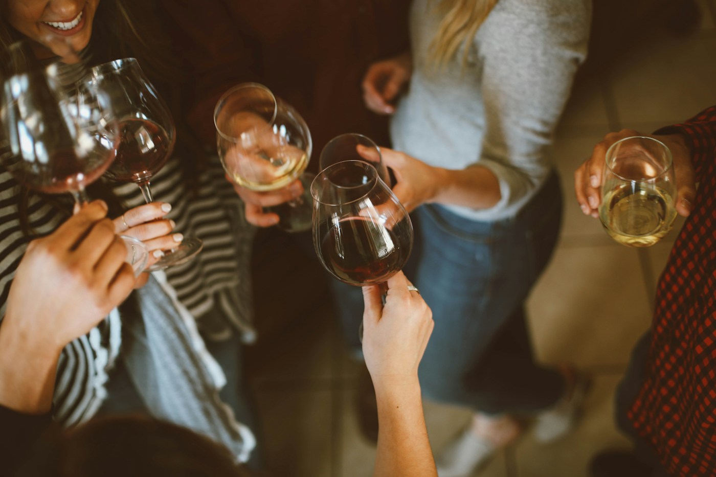 Friends raising glasses together